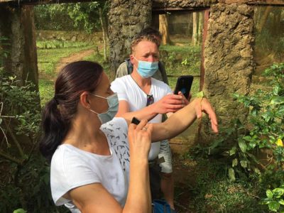 Guided bike trip in Entebbe clients at Botanial Garden with chamelion day cycling tours by Bike2Go Entebbe