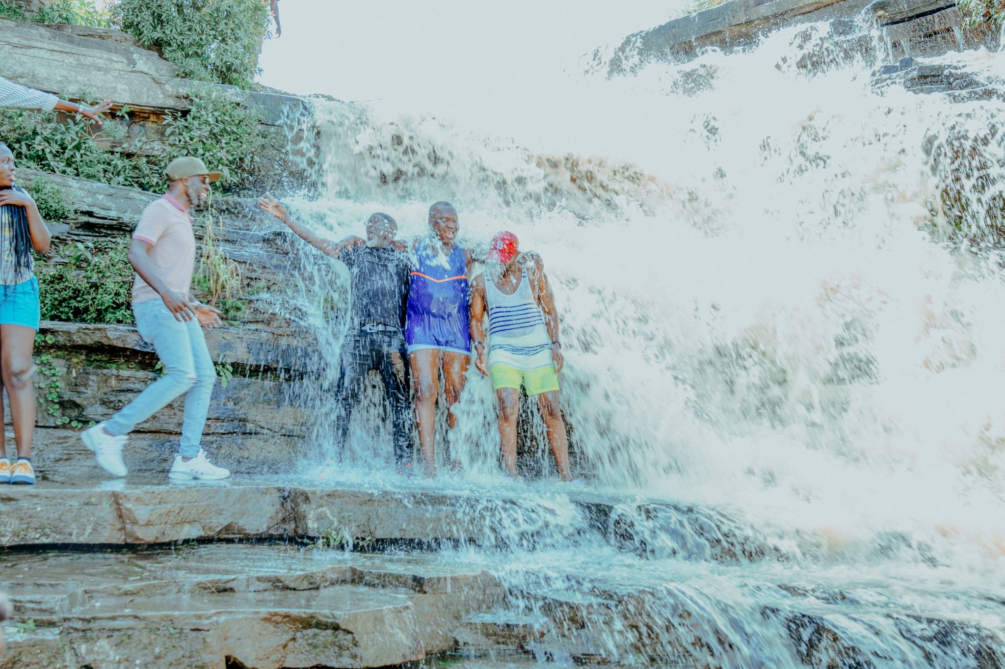 Hotel Condentiel Arua guests standing below Miria Adua Waterfalls Waterfalls Maracha District West Nile Region Uganda Attraction