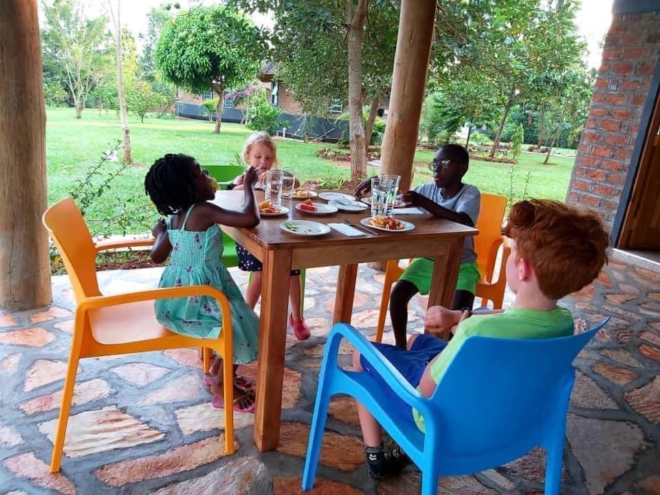Tusubira Village Cottages Jinja Uganda children having breakfast at the restaurant photo by Tusubira Village