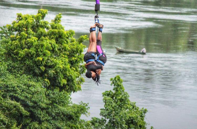local female visitor enjoying bungee jump at the Nile in Jinja Uganda photo by Visit Jinja City
