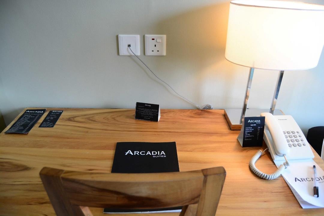 Working Desk with a Telcom Photo Arcadia Suites Hotel - Hotels | Kampala, Uganda Central Region