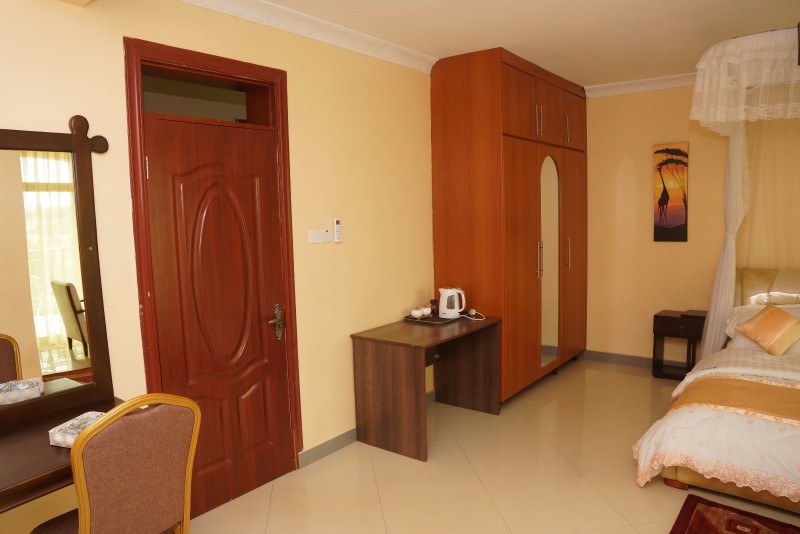 Executive Suite Bedroom furniture Photo Nican Resort Hotel Sseguku Katale Entebbe Kampala Central Uganda 04