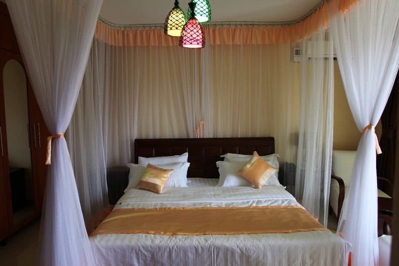 Standard Single Bed lighting Photo Nican Resort Hotel Sseguku Katale Entebbe Kampala Central Uganda