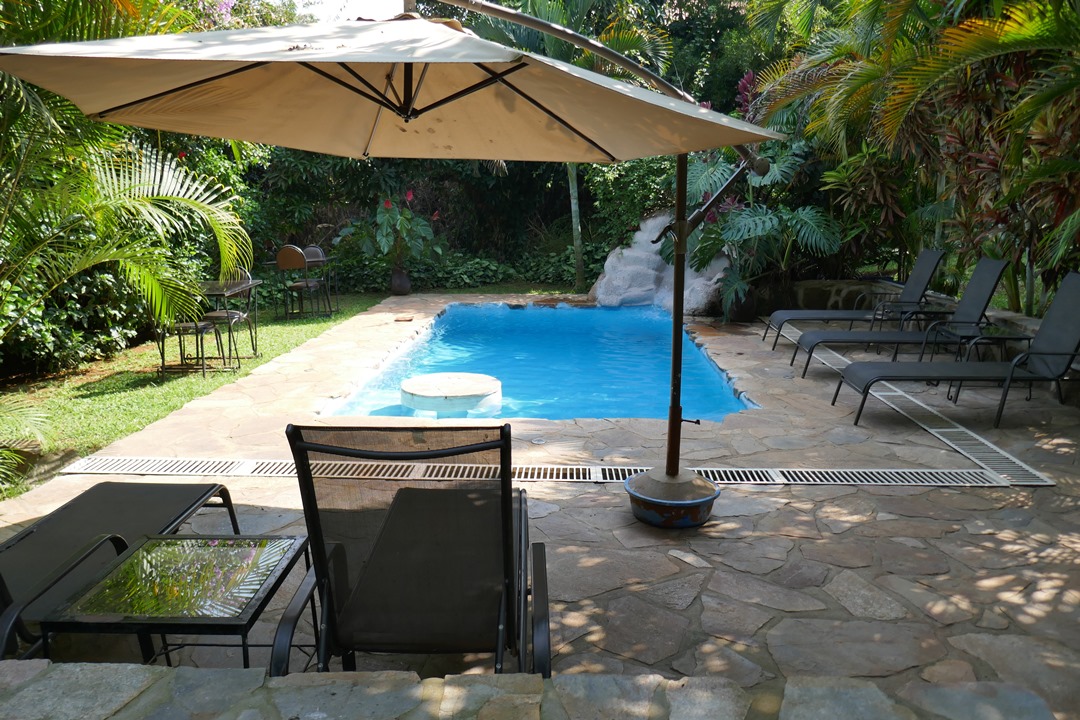 Outdoor Swimming Pool with pool chairs Photo Karibu Guest House Entebbe - Guest Houses | Entebbe, Uganda Central Region