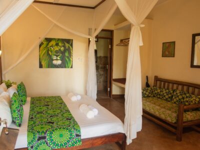 Standard Double Bedroom with sitting chair Photo Karibu Guest House Entebbe - Guest Houses | Entebbe, Uganda Central Region