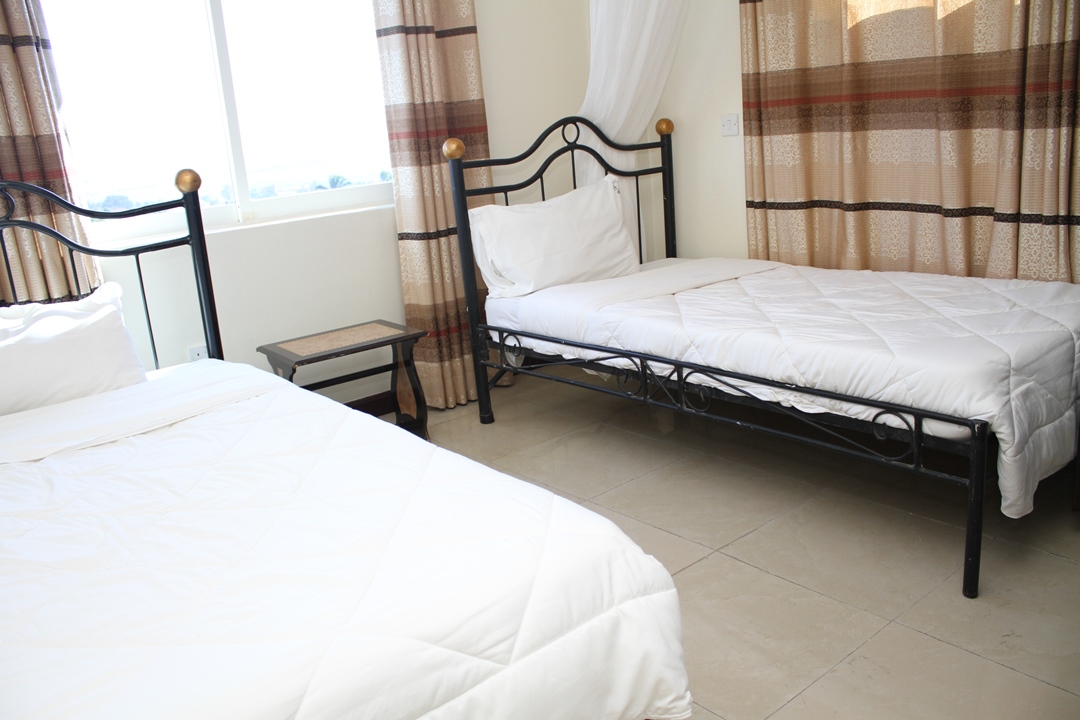 Twin bedroom Photo Karibu BB Suites Entebbe - Hotels | Entebbe, Uganda Central Region 1