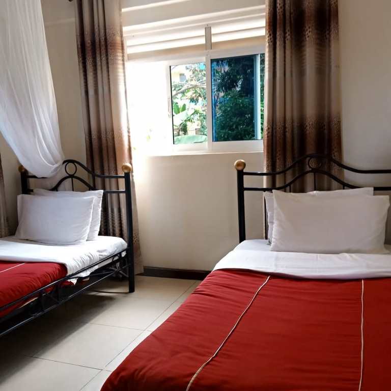 Twin bedroom Photo Karibu BB Suites Entebbe - Hotels | Entebbe, Uganda Central Region