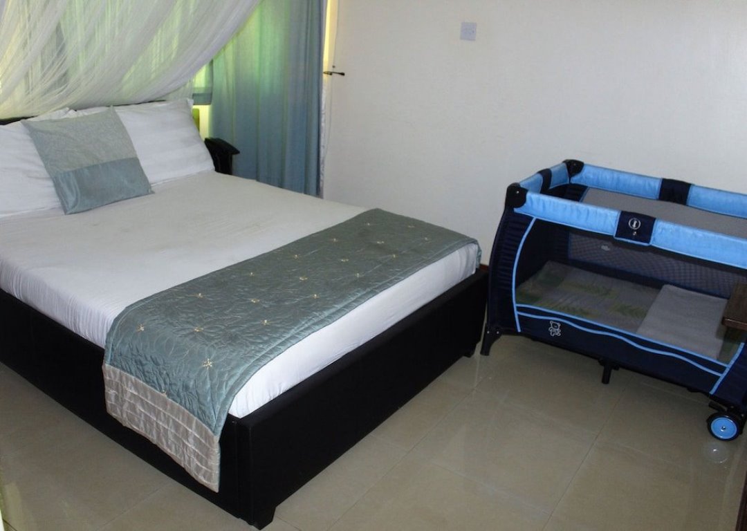 Deluxe Double Bedroom Photo Signature Hotel Apartments Jinja - Hotels | Jinja, Uganda Eastern Region