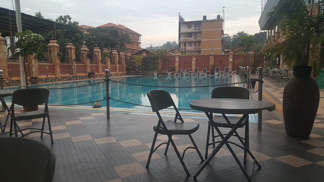 Outdoor swimming pool sitting area Photo Hotel La Grande Kampala - Uganda Central Region