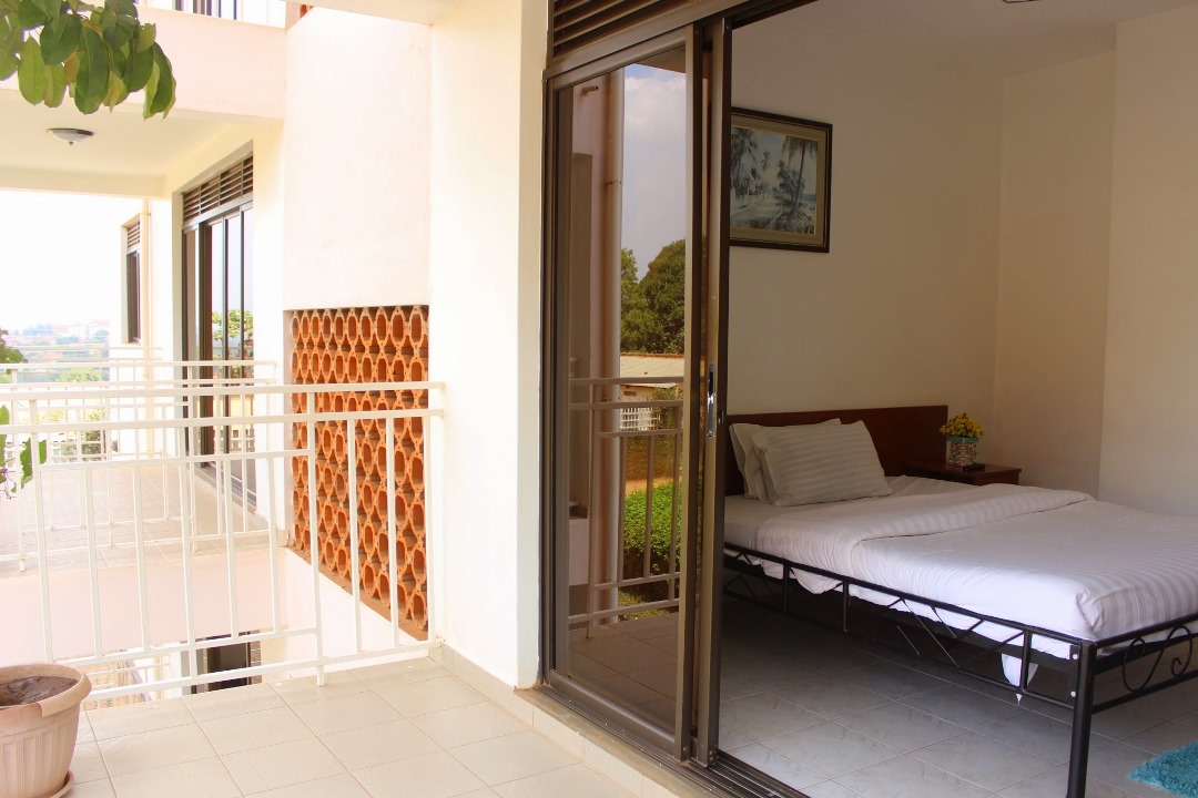 Double Bedroom showing balcony Photo Sky Hotel International Kampala - Uganda Central Region