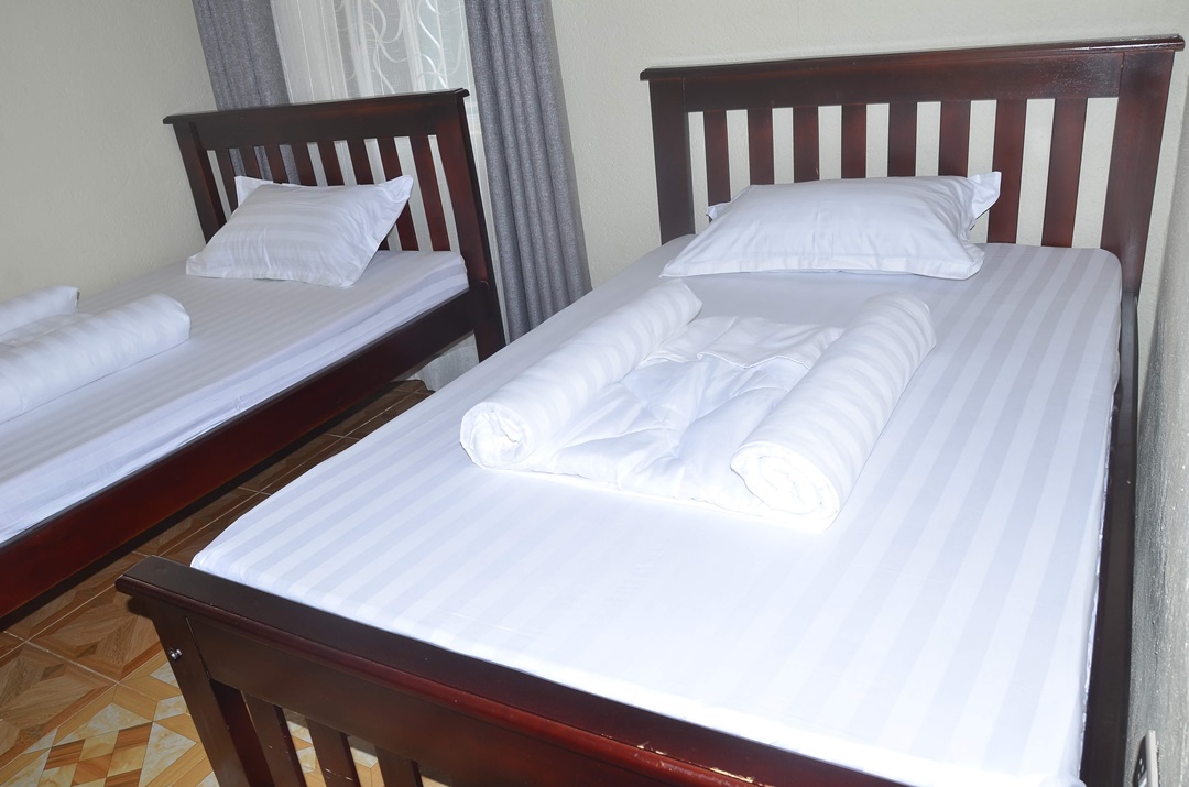 Twin Bedroom Photo Migingo Suites Entebbe, Uganda Central Region 1