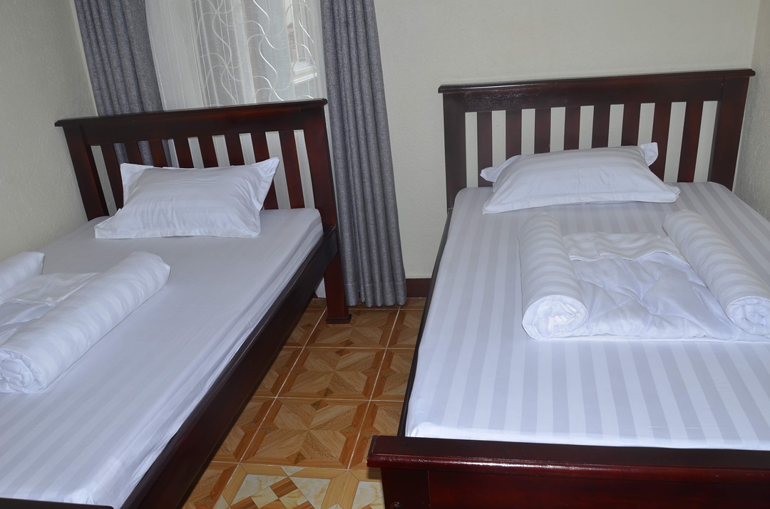 Twin Bedroom Photo Migingo Suites Entebbe, Uganda Central Region