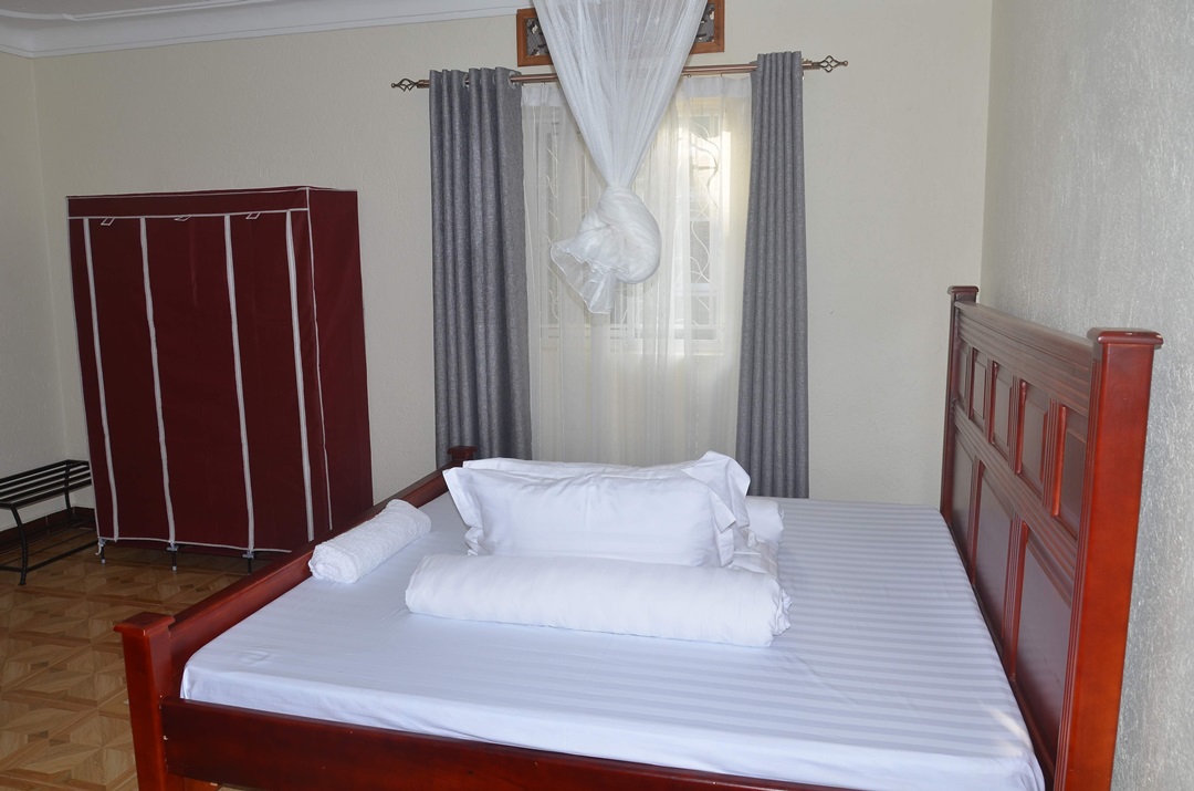 Double Bedroom Photo Migingo Suites Entebbe, Uganda Central Region 1