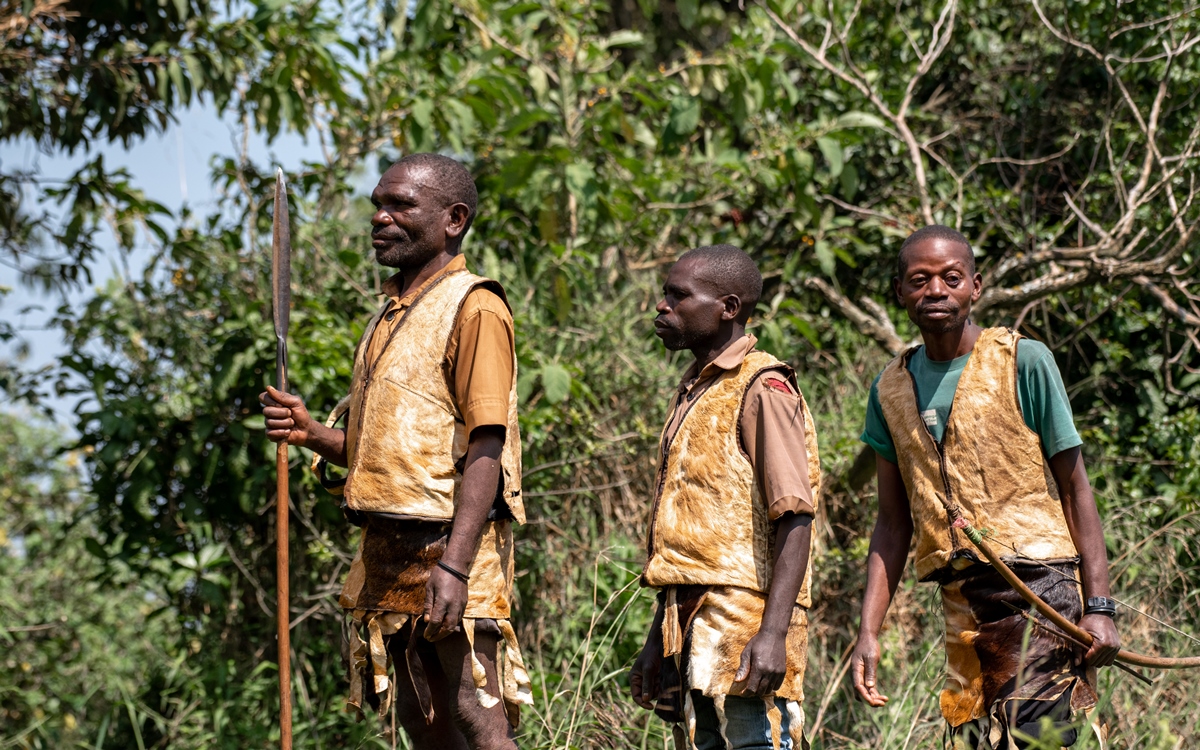 A photograph of three Batwa (pygmy) indigenous people encountered during the Batwa Trail Experience in Mgahinga Gorilla National Park in South-Western Uganda.