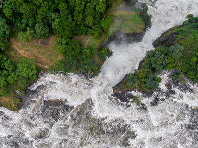 A photograph showing an aerial view of the Murchison Falls captured in Murchison Falls National Park in Northern Uganda.