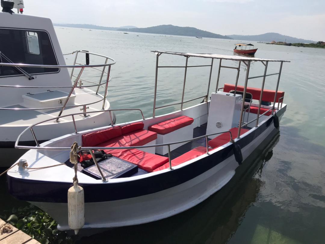 Photo of Kingfisher Boat used on Kampala Cruises & Boat Tours from Munyonyo and Ggaba with visitors aboard