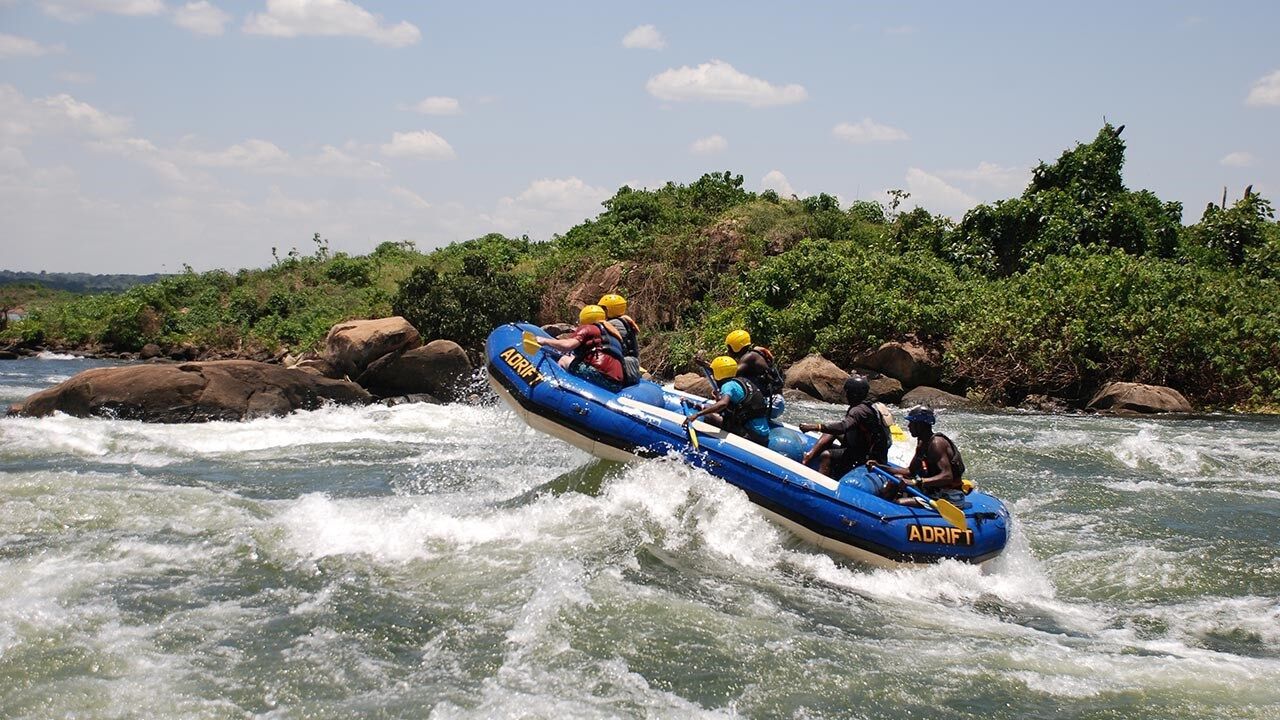 A photograph of a group of people engaging in white water rafting on the Nile River located in Jinja in Eastern Uganda