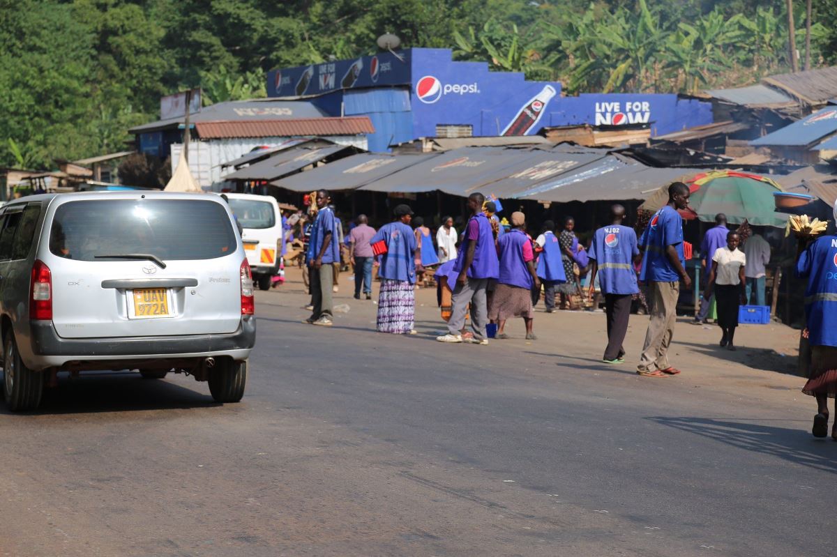 A photograph of street food vendors taken at Najjembe Market located along the Kampala-Jinja Highway in Uganda