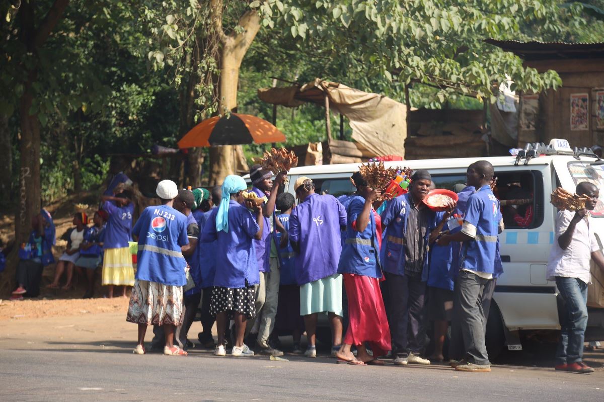 A photograph of street food vendors taken at Najjembe Market located along the Kampala-Jinja Highway in Uganda