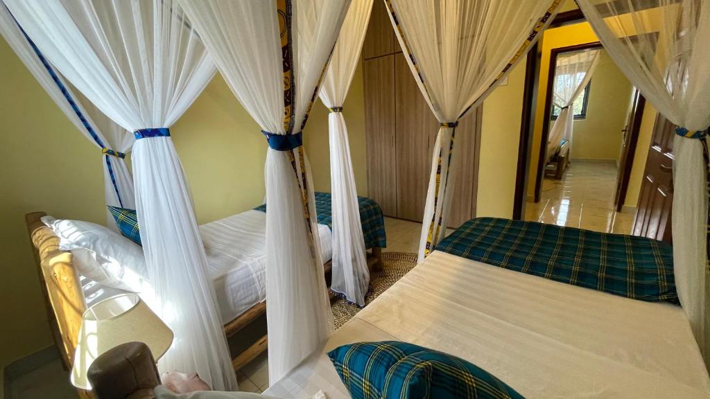 Twin Bedroom Photo UCHA Hotel and Suites Hotel Kampala Uganda Central Region 1