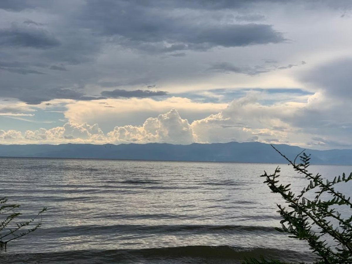 A photograph of the Lake Albert waters taken during a tour to Lake Albert in the Albertine Rift region in Uganda