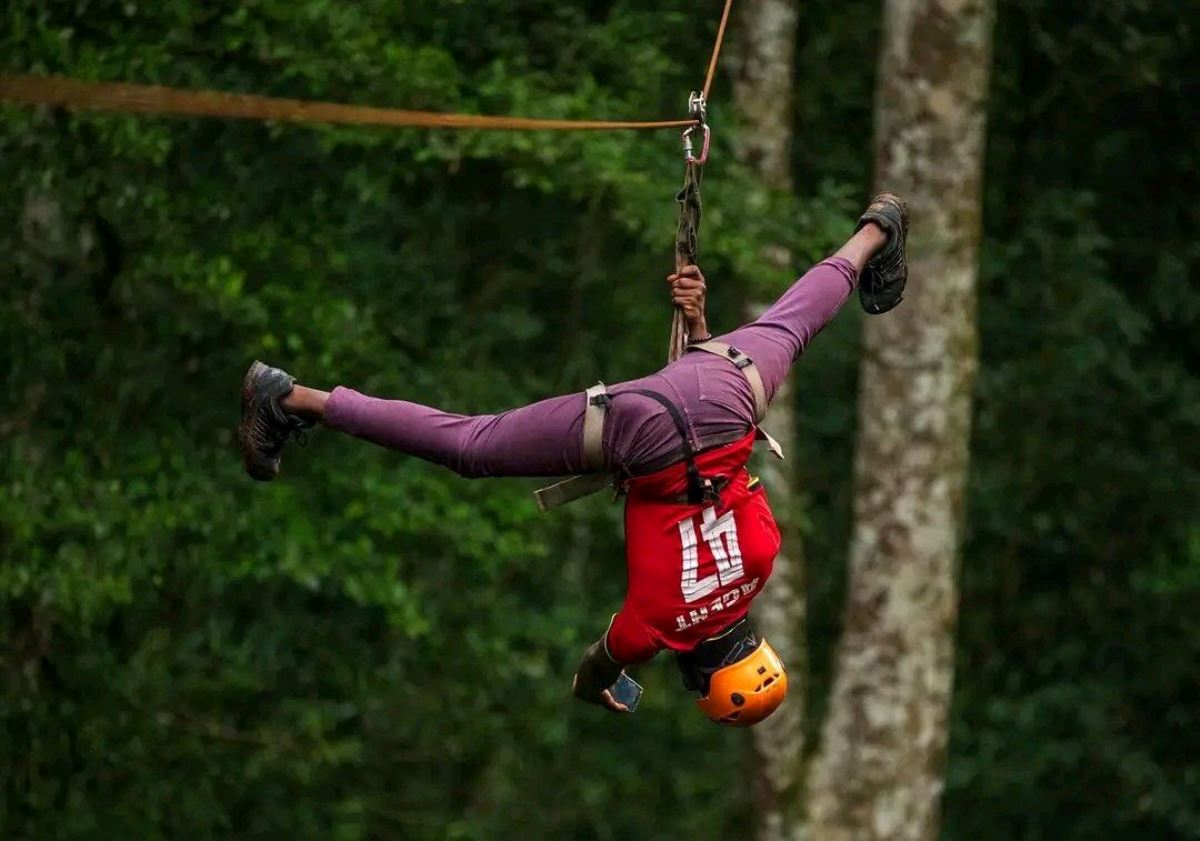 A photograph of a tourist ziplining taken during a ziplining tour in Mabira Forest in Buikwe district in Central Uganda