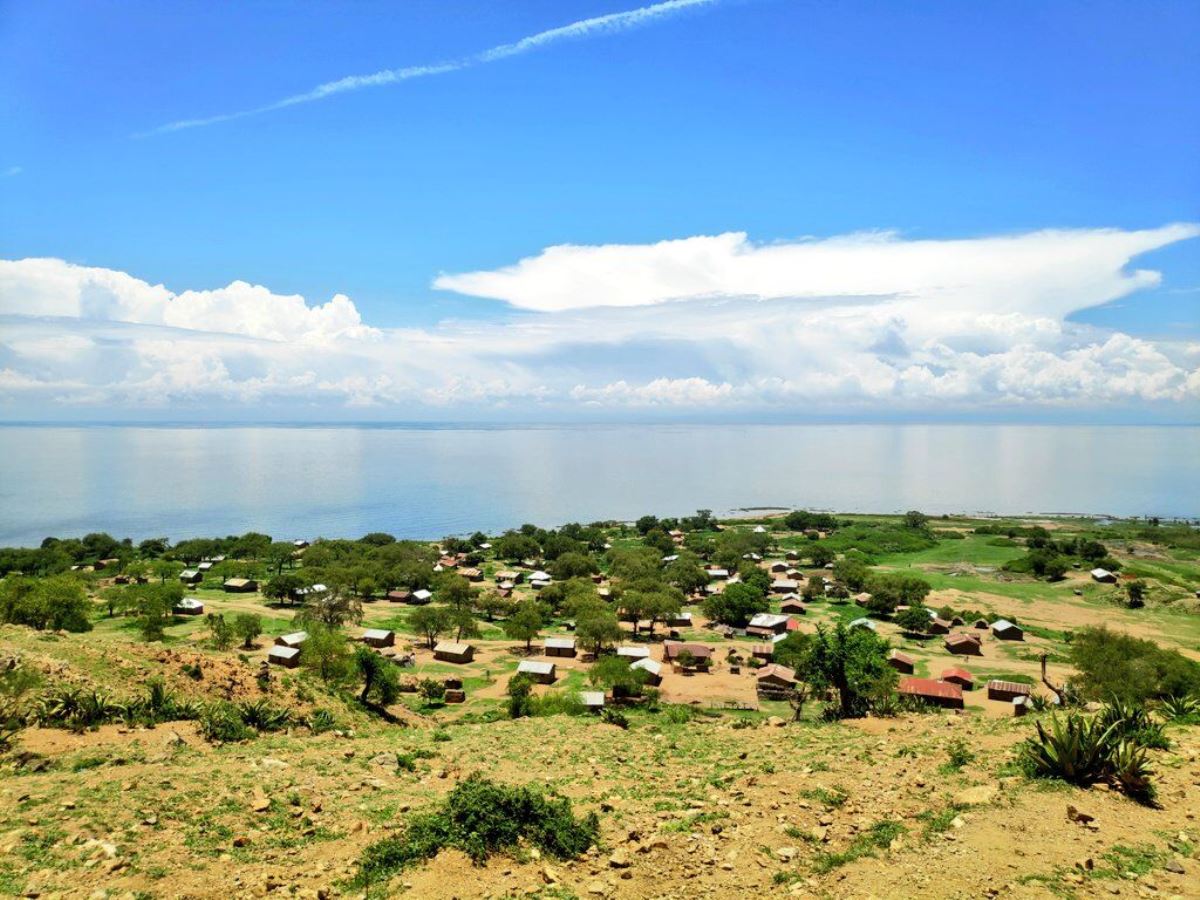 A photograph showing the settlement around Lake Albert taken during a tour a nature walking tour in the areas around Lake Albert located on the border of Uganda and Democratic Republic of Congo