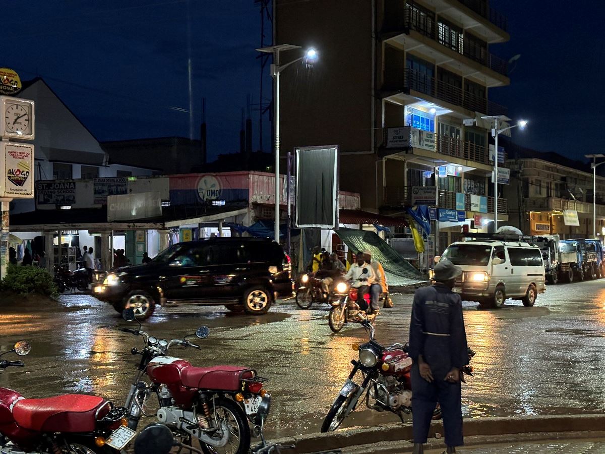 A photograph of bodaboda men parking in a bodaboda stage taken during a night city tour in Soroti in Eastern Uganda.