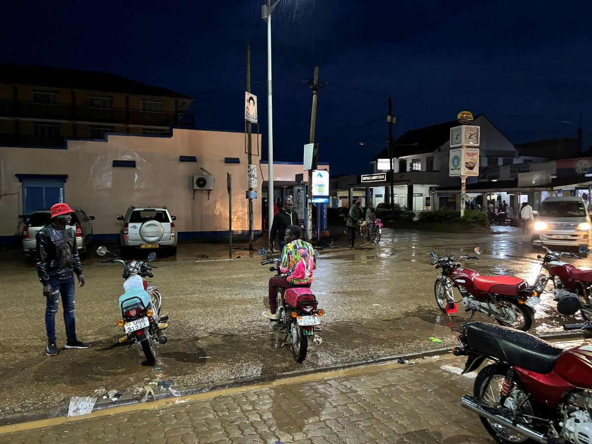 A photograph of bodaboda men parking in a bodaboda stage taken during a night city tour in Soroti in Eastern Uganda.