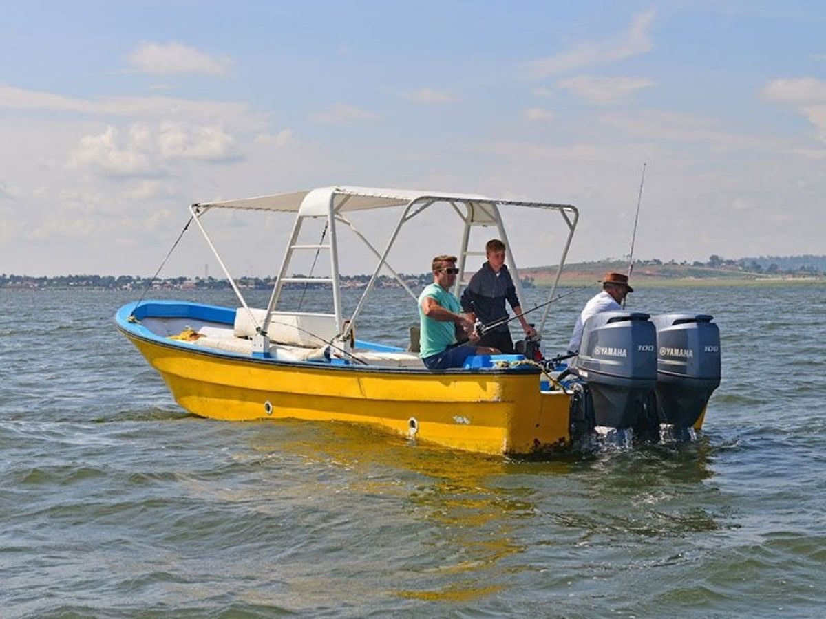 A photograph of tourists fishing taken during a Lake Victoria Fishing trip in Uganda.