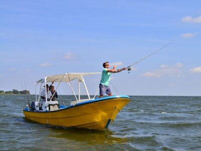 A photograph of tourists fishing taken during a Lake Victoria Fishing trip in Uganda.