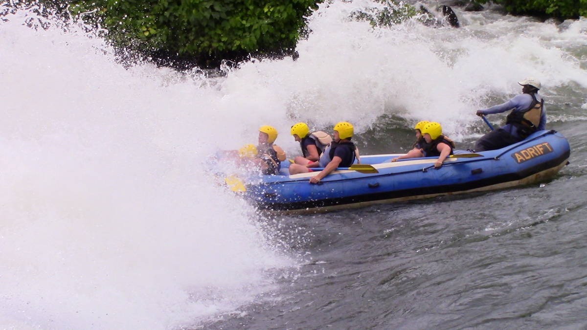 A photograph of tourists rafting taken during a rafting tour in Jinja in Eastern Uganda.