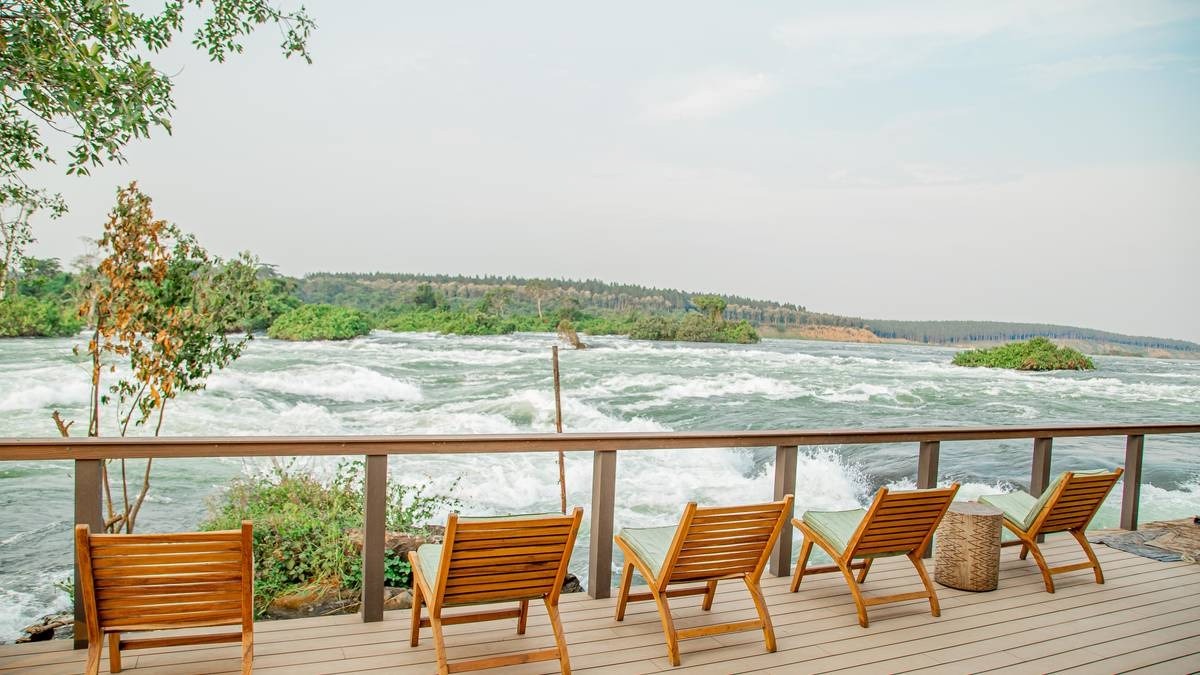 A photograph showing beach chairs and the Mighty Nile River taken from Wildwaters Lodge in Uganda.