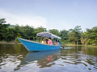 A photograph of visitors taken during a boat cruise while at Lakes of Grace Farm Resort in Muduuma, Wakiso in Uganda.