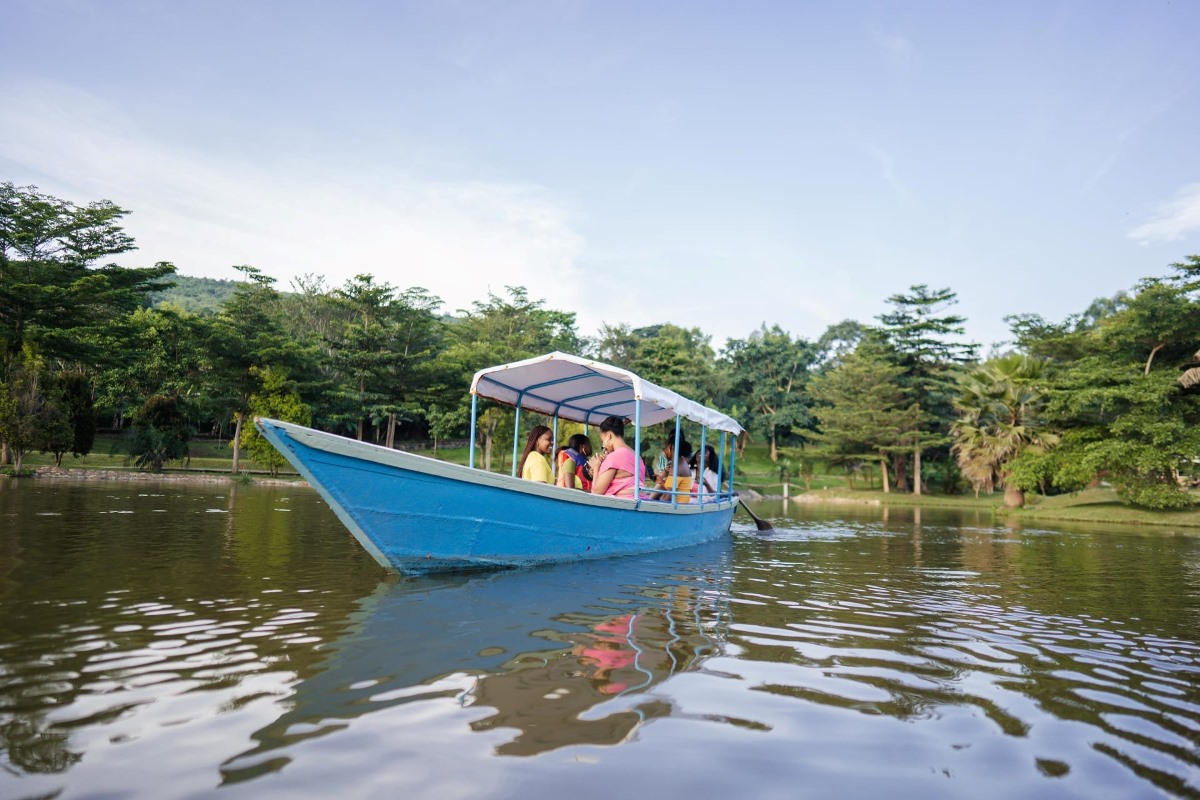 A photograph of visitors taken during a boat cruise while at Lakes of Grace Farm Resort in Muduuma, Wakiso in Uganda.