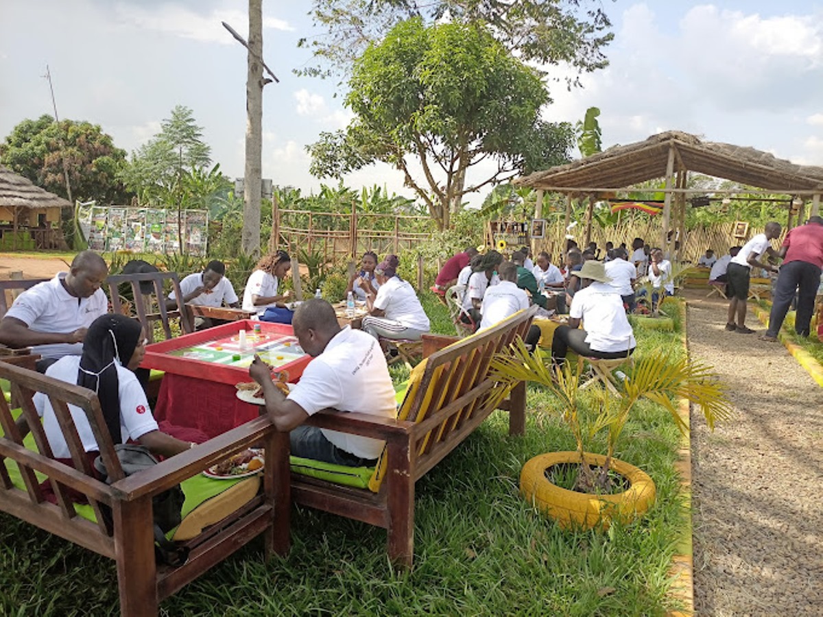 A photograph of visitors at MLinza Farm in Zirobwe, Uganda.