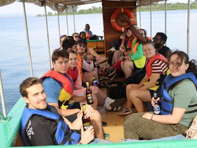 A photograph of tourists taken during a Nile boat cruise on Bujagali Lake.