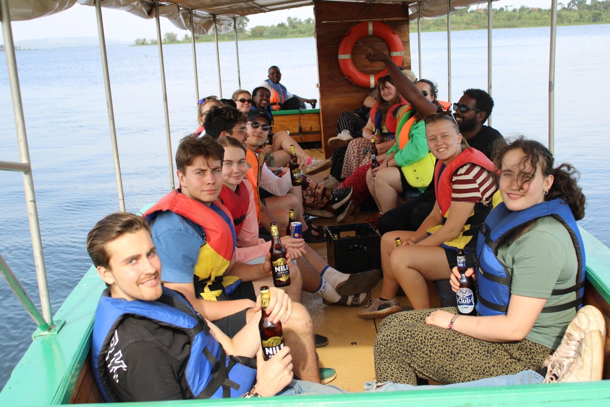 A photograph of tourists taken during a Nile boat cruise on Bujagali Lake.