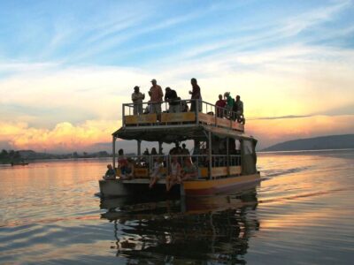 A photograph of tourists taken during a Nile boat cruise on Bujagali Lake.