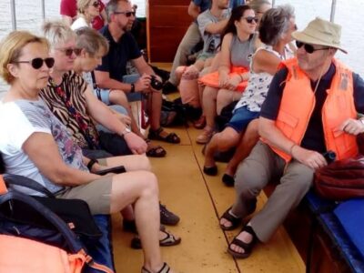 A photograph of tourists taken during the Source of the Nile Cruise in Jinja, Eastern Uganda.