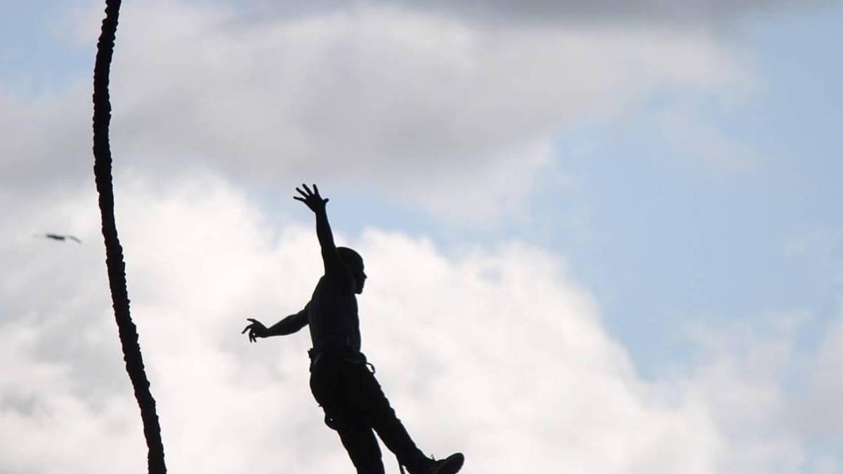 A photograph of a tourist taken during a bungee jumping tour in Jinja in Eastern Uganda.