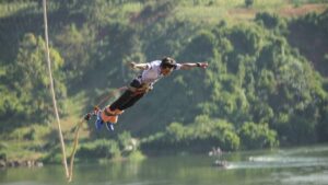 A photograph of a tourist taken during a bungee jumping tour in Jinja in Eastern Uganda.