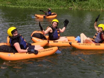 A photograph of tourists river bugging taken during a river bugging tour in Jinja in Eastern Uganda.