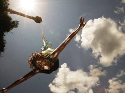 A photograph of a tourist taken during a bungee jumping tour in Jinja in Eastern Uganda.