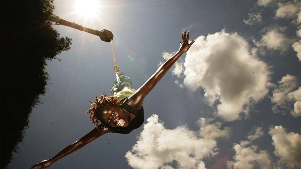 A photograph of a tourist taken during a bungee jumping tour in Jinja in Eastern Uganda.