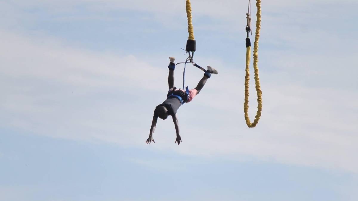 A photograph of a tourist taken during a bungee jumping tour in Jinja in Eastern Uganda.