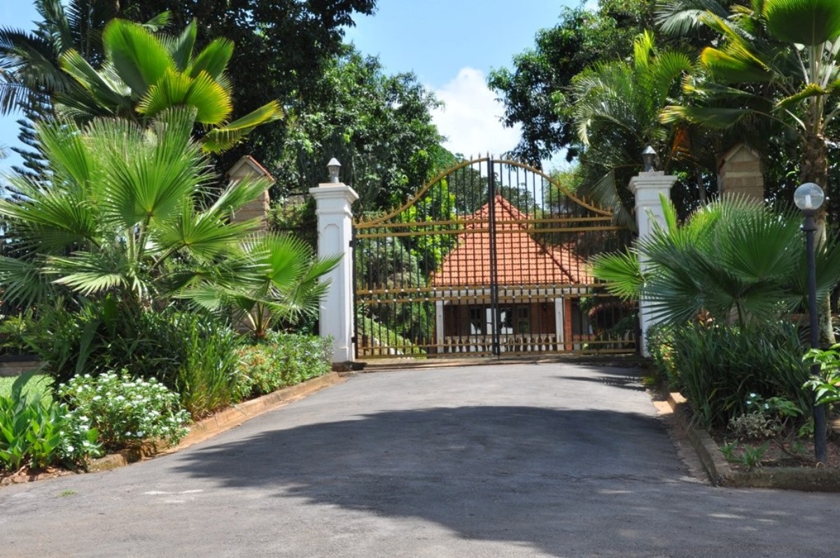 A photograph of the Banda palace gate located on Banda Hill in Uganda