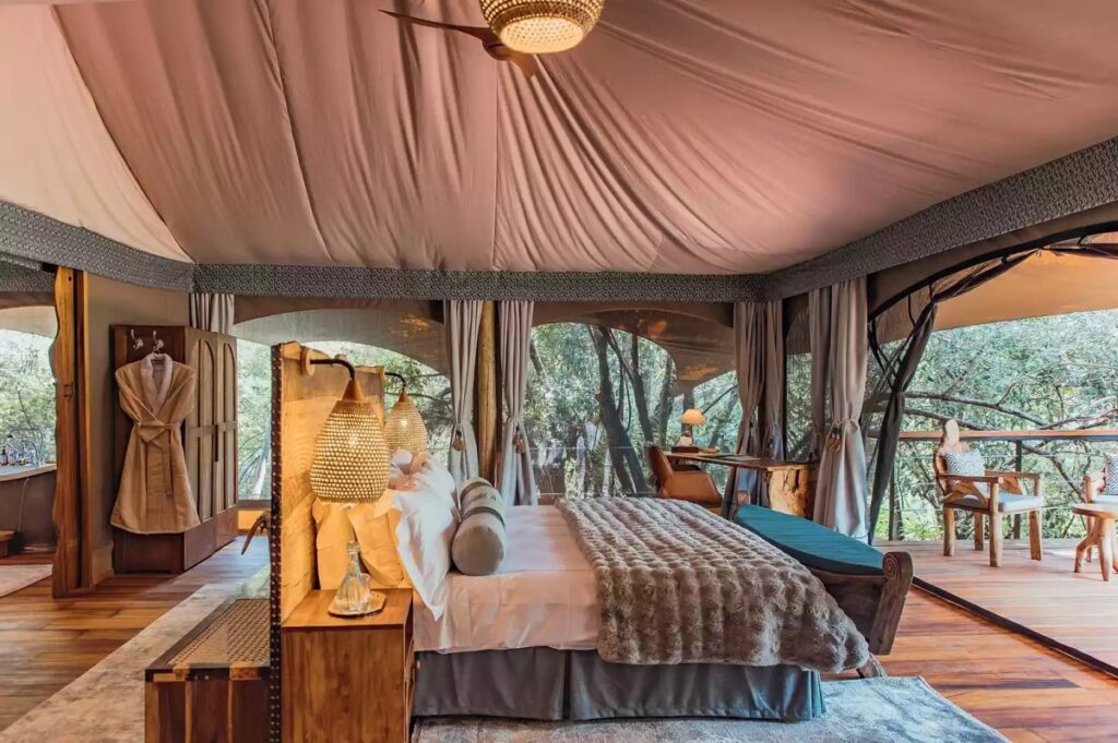 Photograph of the interior of a guest room at Mara Toto Tree Camp