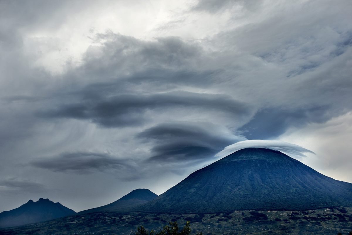 Photograph of a dormant volcanic mountain ranges taken during a hiking tour in Volcanoes National Park in Rwanda