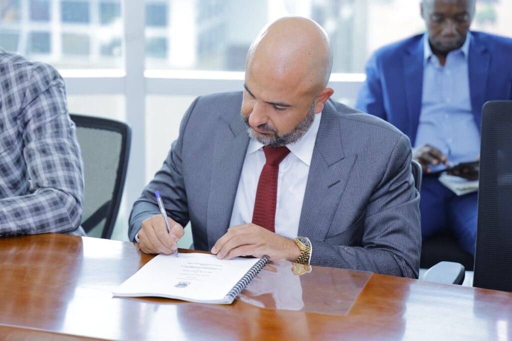 Photograph of the Managing Director of One Nature Hotels Limited, Eng. Hani Saliba taken during the signing of the 25-year concession agreement for the development and operation of a luxury lodge at Channel Track near the renowned Kazinga Channel in Queen Elizabeth National Park